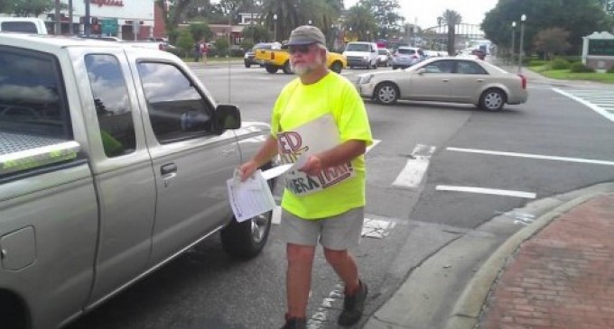 Man arrested for peacefully protesting red light cameras