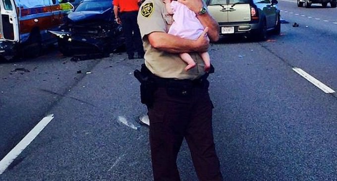 Cop Cradles Baby Gains Legions of Fans