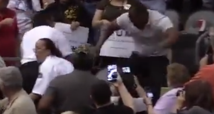 Black Trump Supporter Beats Protestor Wearing KKK Cap
