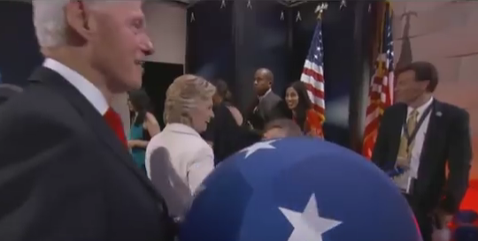 Hillary Celebrates her Nomination over Fallen American Flag