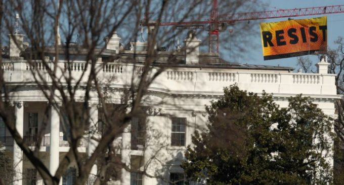 Greenpeace Activists Climb Crane, Hang ‘Resist’ Sign Near White House