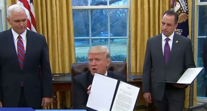 Trump Issues Executive Orders to Withdraw from TPP, Freeze Federal Hiring