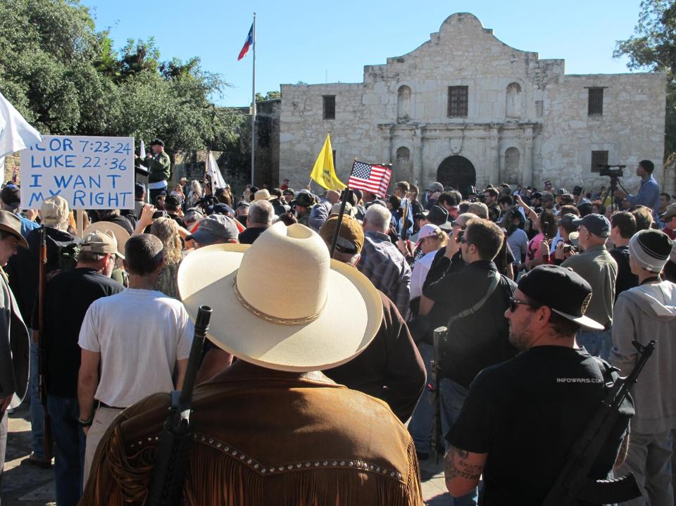 Armed gun rights activists rally at the Alamo